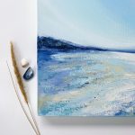A Soulful Whisper - close up detail of artwork. Clear blue sky, the palest sandy beach stretching into the distance